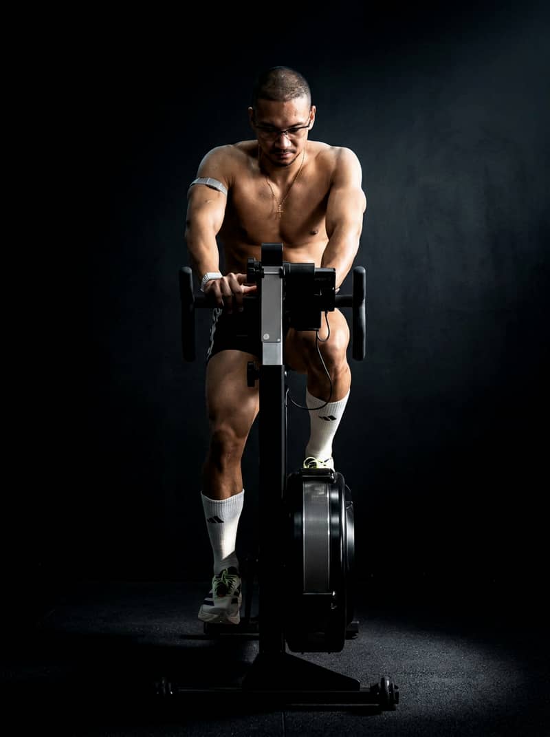 An athlete deep into an effort on an air bike